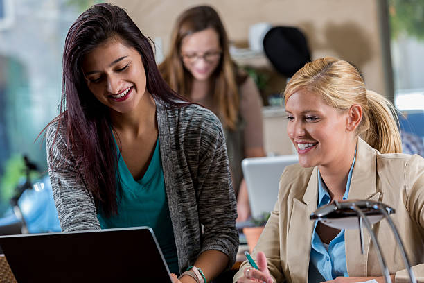 istock Confident female businesswomen discuss project 628013232