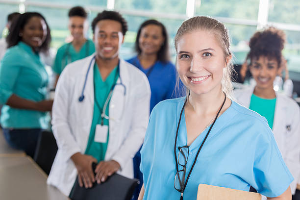 istock Confident medical professional with colleagues 628013366