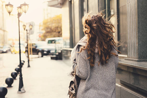 istock Woman walking down the street 628013950