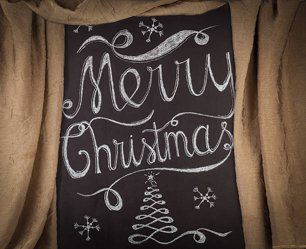 istock Merry Christmas hand drawn lettering design framed by curtain 628014072