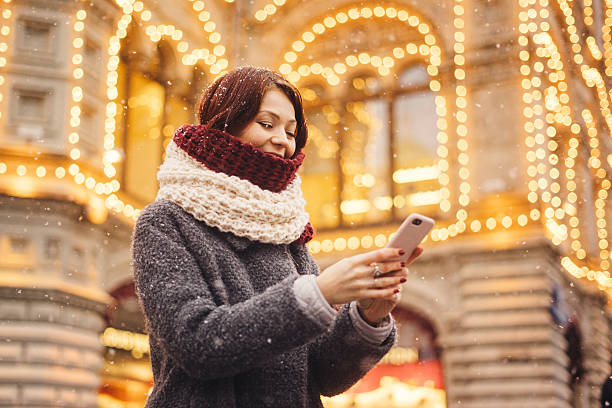 istock Woman with mobile phone on the street 628015314