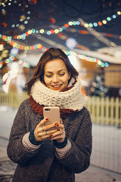 istock Woman with mobile phone on the street 628016690