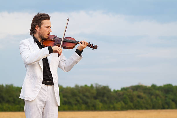 istock Professional violinist playing the violin outdoors 628016946