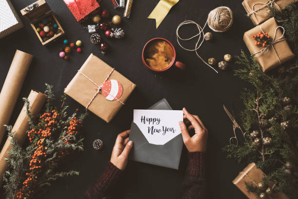 istock Writing Christmas cards, New Year 2017 table top flat lay 628018070