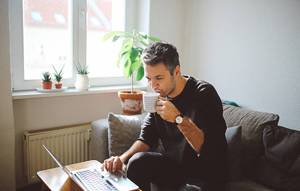 istock Young man doing a freelance job from home 628023620