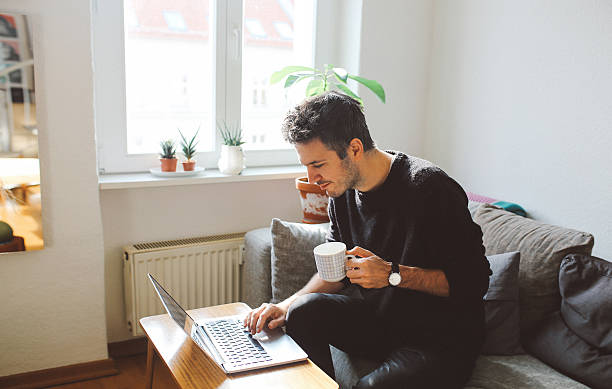 istock Young man doing a freelance job from home 628023676