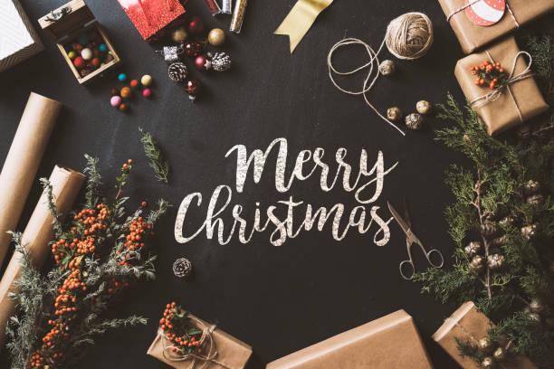 istock Calligraphy Merry Christmas chalk written blackboard, flat lay 628024880