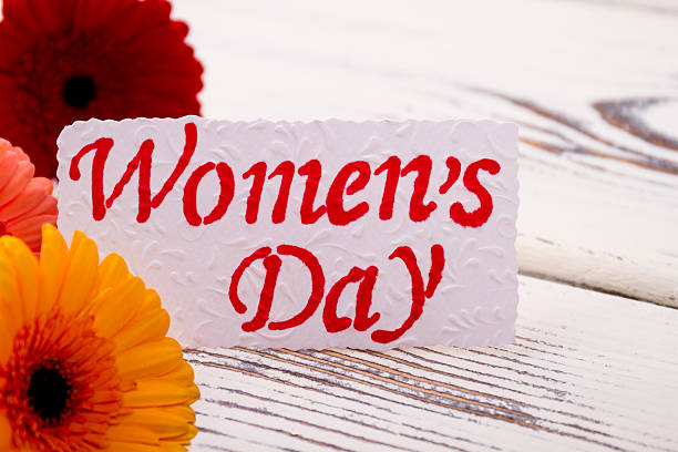 istock Women`s Day card near gerberas. 628025660