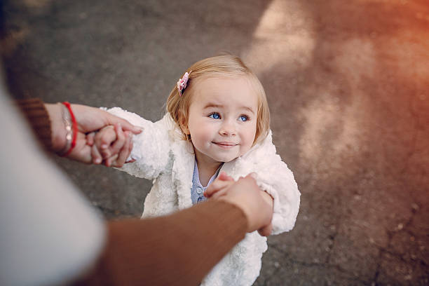 istock young family walking in the park 628027960