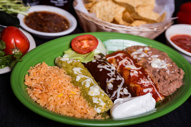 istock Mexican enchiladas trio with rice and beans 628028834