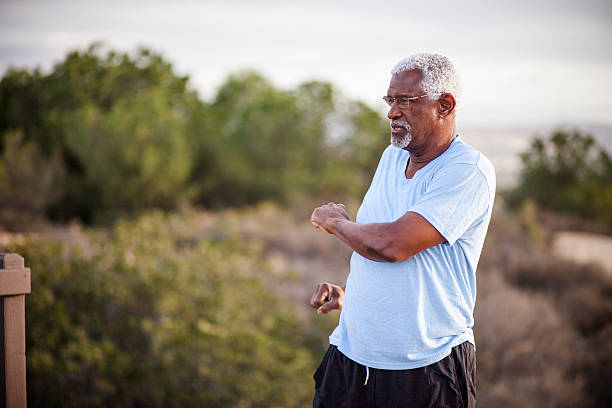 istock Senior Black Man Stretching and Exercising Outdoors 628029910