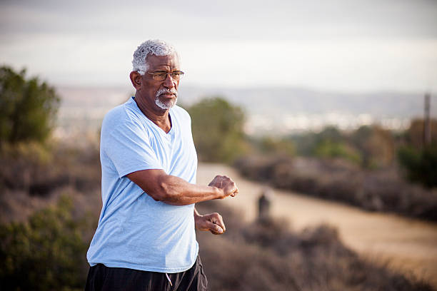 istock Senior Black Man Stretching and Exercising Outdoors 628029916