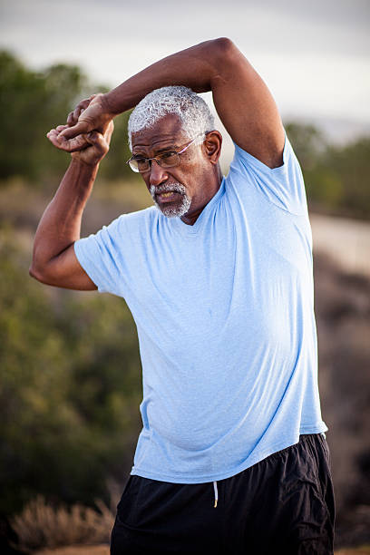 istock Senior Black Man Stretching and Exercising Outdoors 628029938