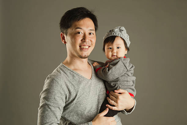 istock Father and baby girl in studio shot 628030432