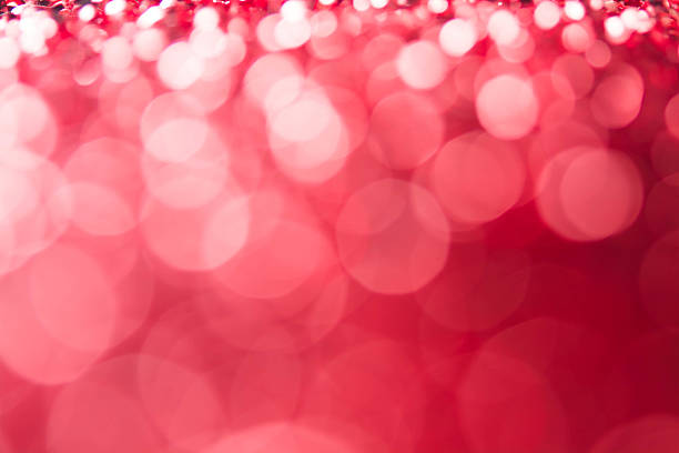 istock Red bokeh holiday textured Christmas decorations background 628032650