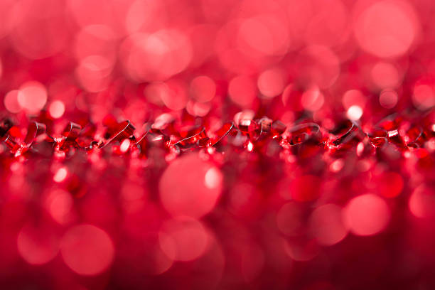 istock Red bokeh holiday textured Christmas decorations background 628032676