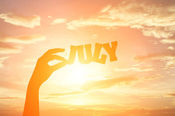 istock Silhouette of hand holding paper cut text 