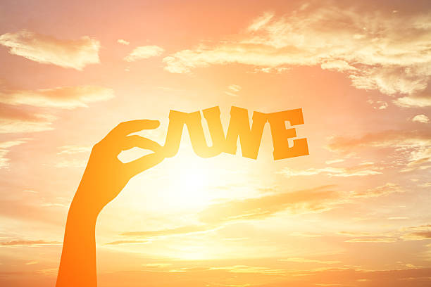 istock Silhouette of hand holding paper cut text 