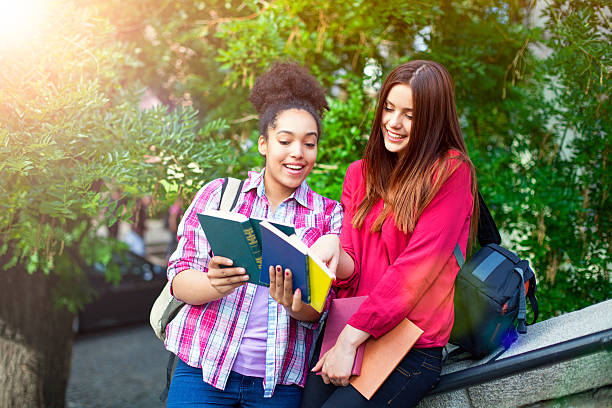 istock Students outdoor with books 628033624