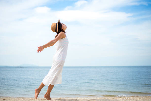 istock Young women jumping and happy on the beach 628033906
