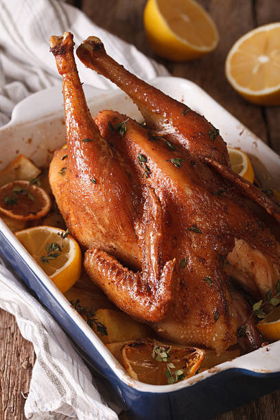 istock whole chicken with lemon baked in a baking dish closeup 628036302