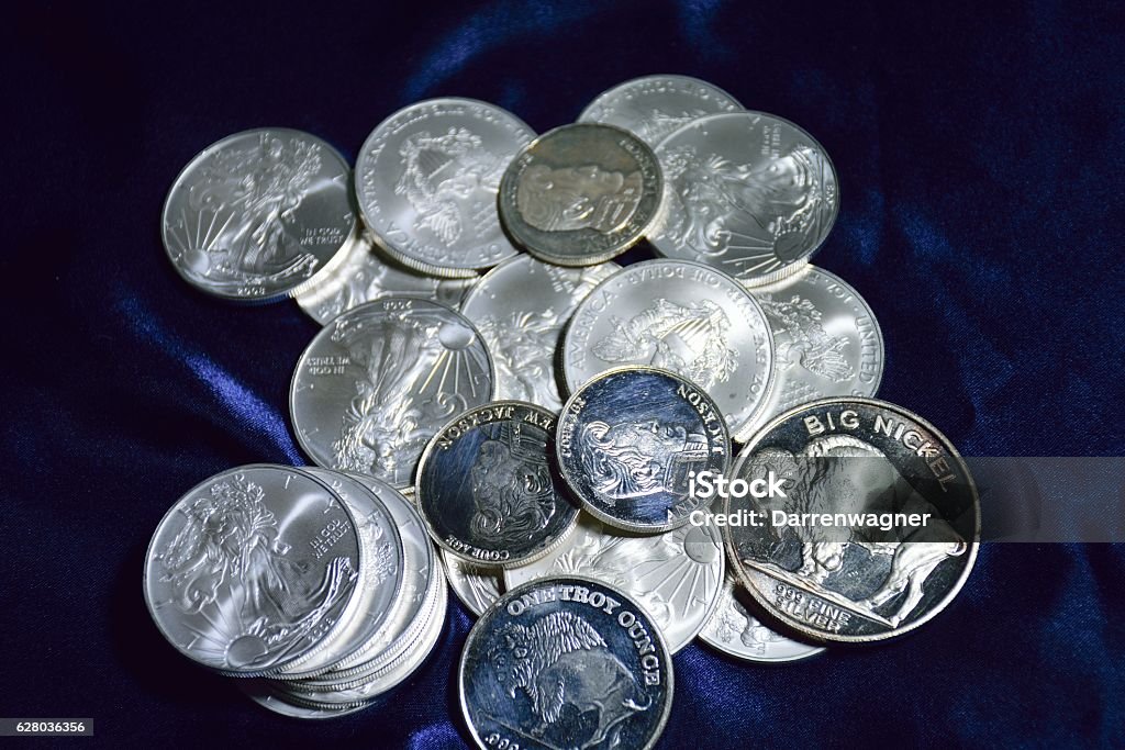 various silver coins various silver coins in a pile Coin Stock Photo