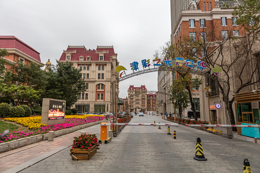 Tianjin, China - October 20, 2016: Tianjin downtown street view.  A shopping center on the background.