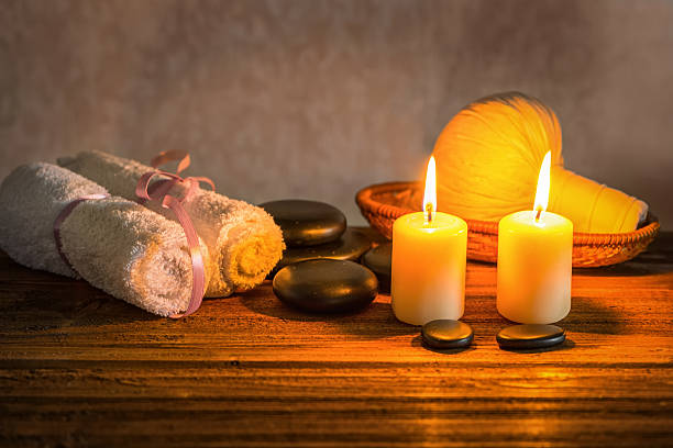 istock spa composition of white towels, candles with natural light 628038918