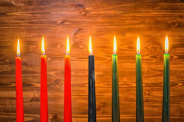 Photo of Kwanzaa festival concept with seven candles red, black and green