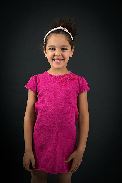istock Beautiful girl doing different expressions in different sets of clothes: smile 628064314