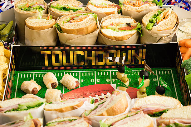 Football Snack Stadium filled with sub sandwiches, veggies and chips.