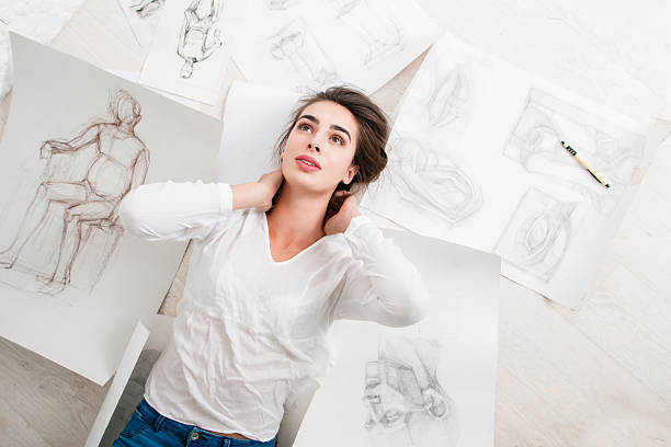 istock Tired artist having rest on floor top view 628064750