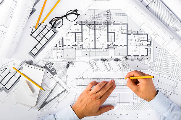 construction plans and male hands drawing on blueprints - instrument of measurement organization housing project housing development imagens e fotografias de stock