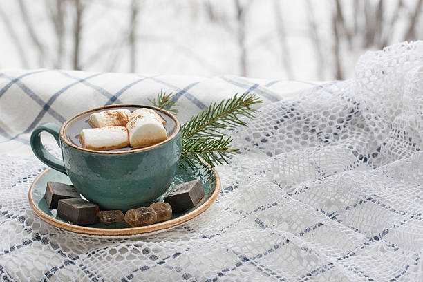 istock Christmas concept. Blue mug of coffee with marshmallow on white. 628066802