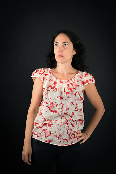 istock Beautiful woman doing different expressions in different sets of clothes: thinking 628066858