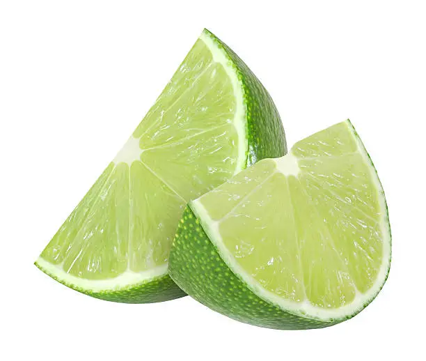 Photo of lime fruit slices isolated on white background with clipping path