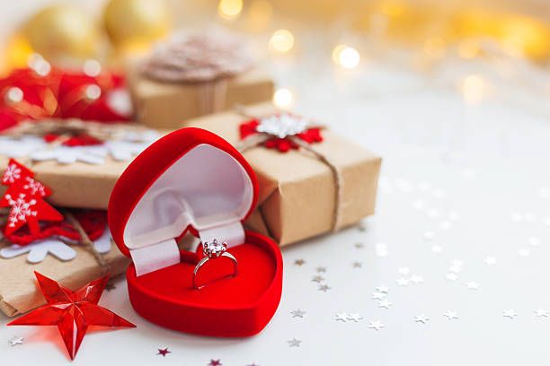 Christmas and New Year background with engagement ring stock photo