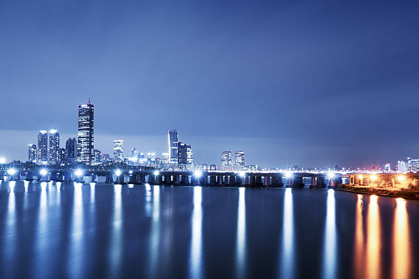 istock modern office buildings near water in seoul at twilight 628075310