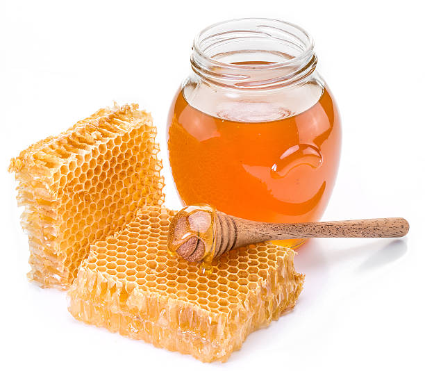 istock Jar full of fresh honey and honeycombs. 628076252