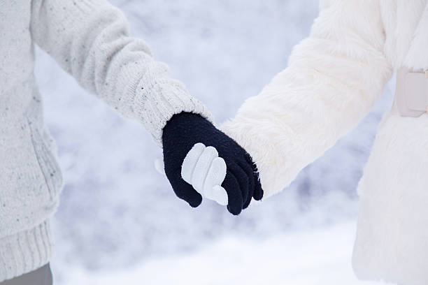 istock Man's and woman's hands holding each other by hands. Winter. 628077820