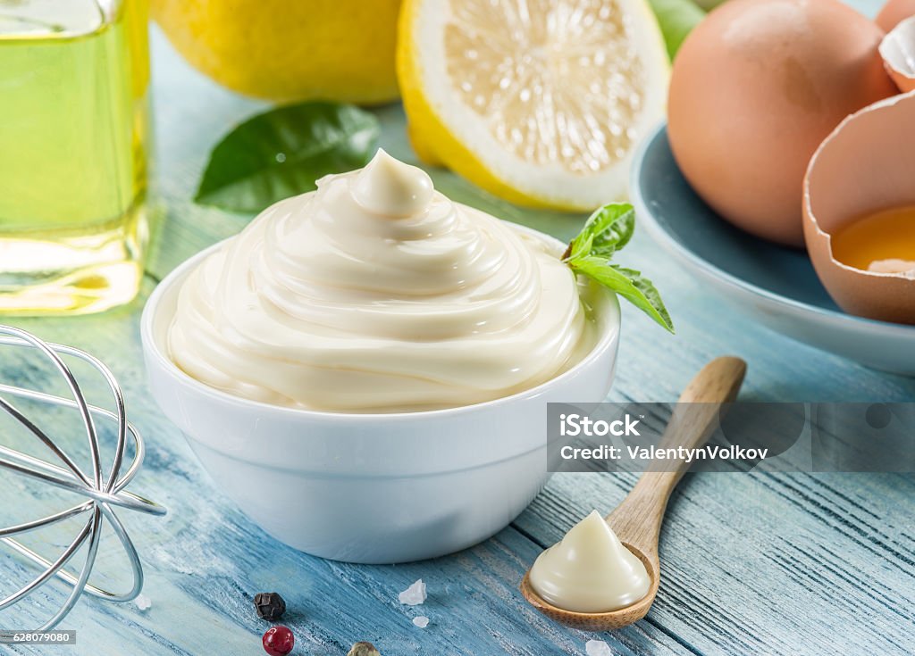 Natural mayonnaise ingredients and the sauce itself. Mayonnaise Stock Photo