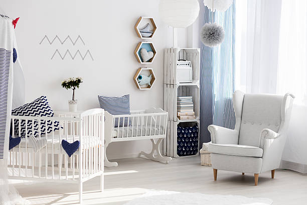 istock Nursery with white chair and cradle 628085754