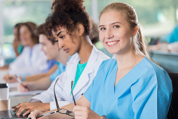istock Confident female medical or nursing student attends class 628087004