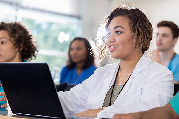 istock Beautiful medical student uses laptop during class 628087026