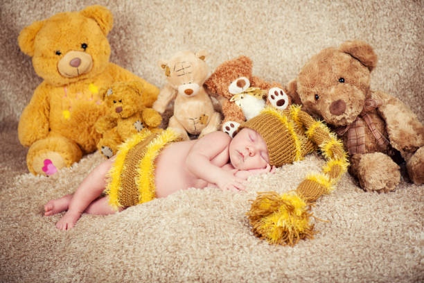 istock Newborn baby sleeping on toys background. 628088796