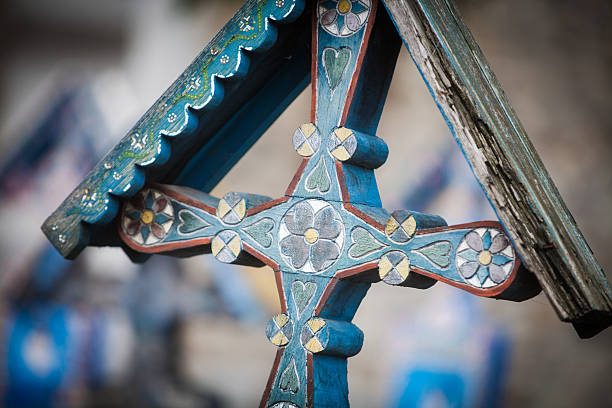 Image of a traditional painted cross in Sapanta, Romania, in a graveyard called \