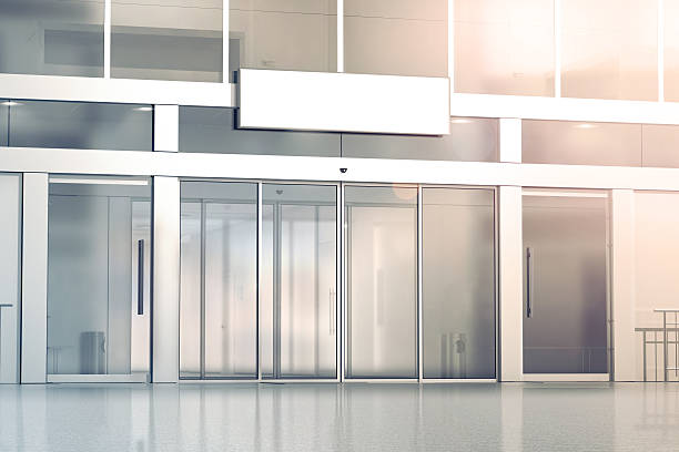 istock Blank white signage on the store glass doors entrance mockup 628089270