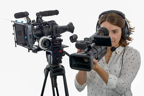 istock pretty young  girl with  professional camcorder, on white 628089640