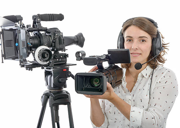 istock pretty young  girl with  professional camcorder, on white 628089934