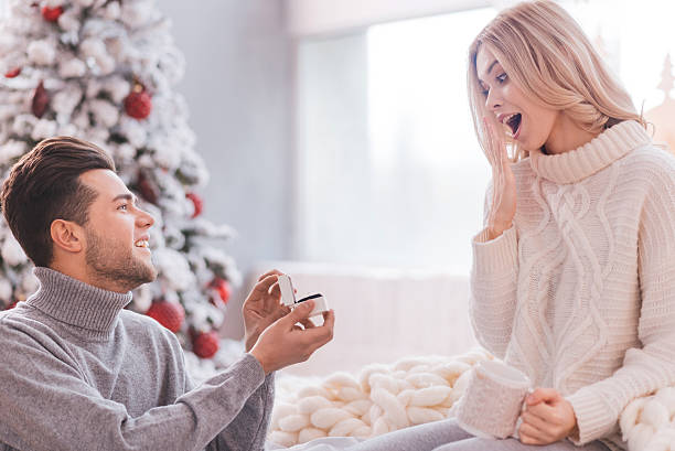 istock Handsome young man making a proposal to his girlfriend 628091714